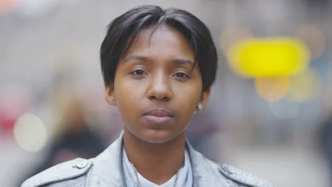 Portrait of transgender man looking to camera out in the street Stock Footage 101079899