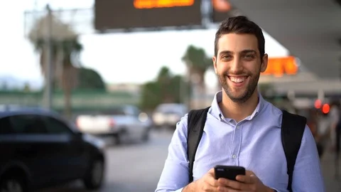 Portrait of Traveler Guy Using Mobile Stock Footage 89242795