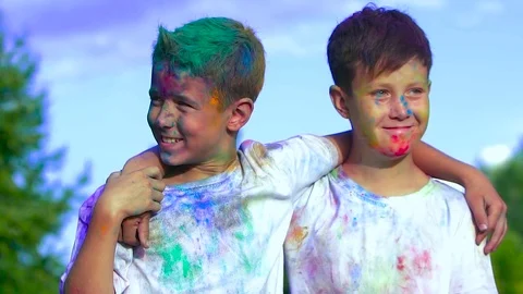 Portrait of two boys holding each other on the shoulders smiles in delight after Видео 70875199