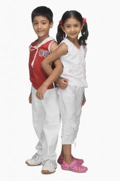 Portrait of two children back to back and hand in hand Fotos Stock
