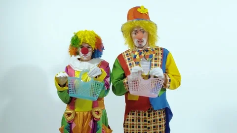 Portrait of two clowns having fun together holding little baskets Stockbeeldmateriaal 70283684