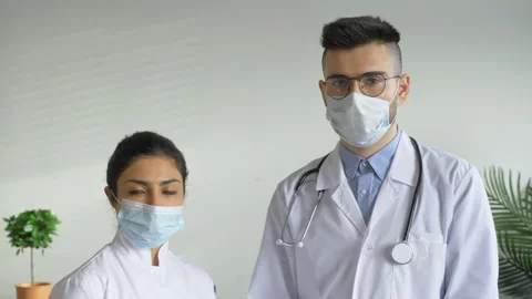 Portrait Two Doctors A Man and a Woman Looking at the Camera Stock Footage 150689790
