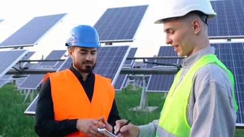 The portrait of two engineers with the project plan at the solar farm. Stock Footage 140002244