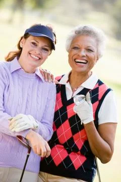 Portrait of two female golfers Photos