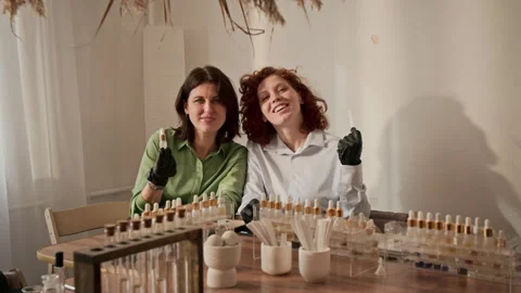 Portrait of Two Female Perfumers Smiling at Camera during Master Class Stock Footage 337110597