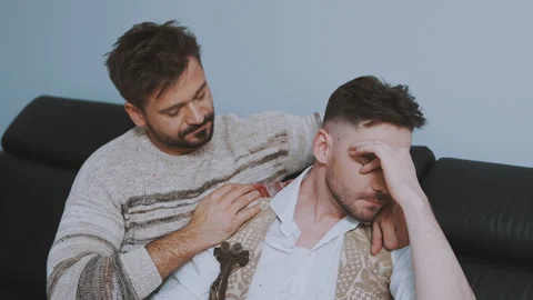 Portrait of two handsome men having trouble in relationship sitting on the couch Stock Footage 146244511