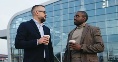 Portrait of the two handsome multiethnical men in business style standing Stock Footage 100449902