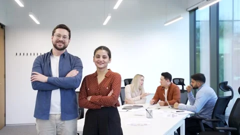 Portrait of two happy co-workers man and woman standing on background diverse  Stock Footage 301973542