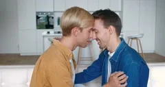 Two young men kissing, in the middle of tokio, night