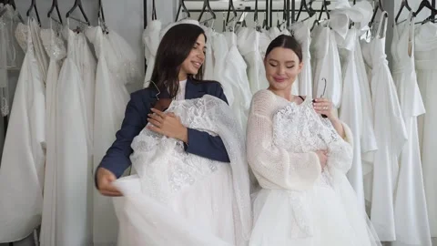 Portrait of two happy young brides in a wedding salon. Stock Footage 300831473