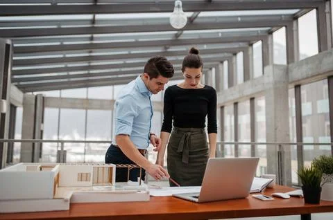 Portrait of two managers in modern office. Stock Photos