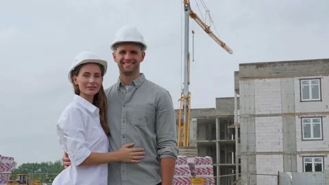 Portrait of two modern architects in white helmets, looking at the camera Stock-Footage 159075706