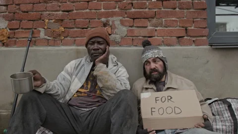 Portrait of Two Multiethnic Middle-Aged Homeless Men Begging for Money Outdoors Stock Footage 317299915