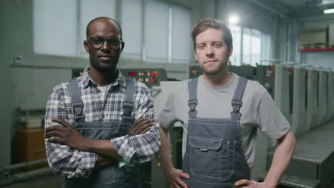 Portrait of Two Multiethnic Technicians Standing in Printing Factory Video stock 335483347