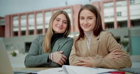 Portrait of two nice young Caucasian students girls happy smiling looking to Stock Footage 120746148