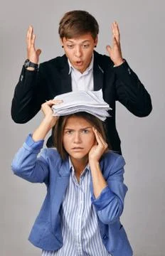 Portrait of two people. Problems in their business relationships. The Chief Stock Photos