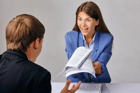 Portrait of two people. Problems in their business relationships. The Chief Stock Photos