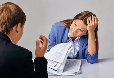 Portrait of two people. Problems in their business relationships. Stock Photos
