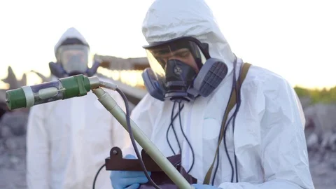 Portrait of two scientists in white overalls and protective masks taking Stock Footage 110442559
