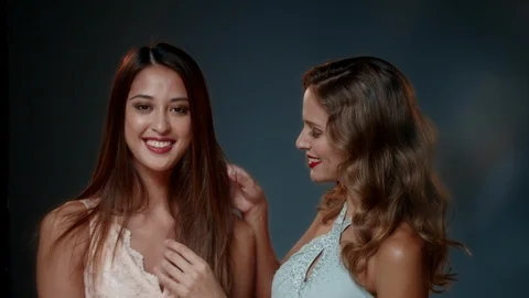 Portrait of two women posing in studio. Stock Footage 90706993