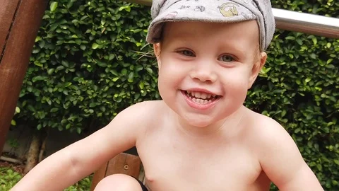 Portrait of a two-year-old shy smiling boy. Stock Footage 104848564