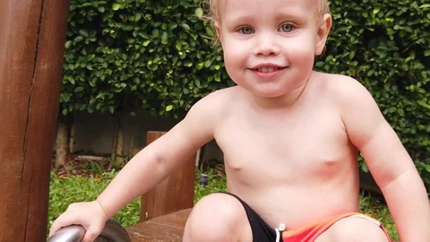 Portrait of a two-year-old shy smiling boy. Stock Footage 104848572