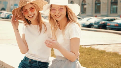 Portrait of two young beautiful blond smiling hipster girls Stock Footage 141208451