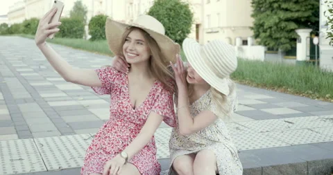 Portrait of two young beautiful smiling hipster girls in trendy sundress Stock-Footage 142272146