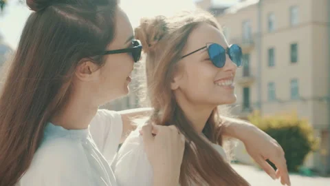 Portrait of two young beautiful smiling hipster girls Stock Footage 142359472