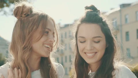 Portrait of two young beautiful smiling hipster girls Stock Footage 142360618