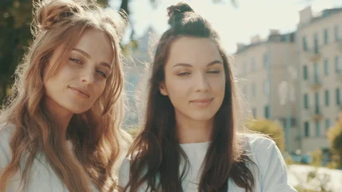 Portrait of two young beautiful smiling hipster girls Stock Footage 142363397