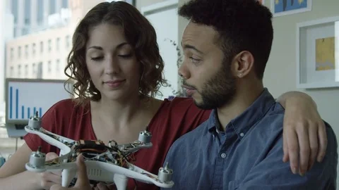 Portrait of Two Young Computer Scientists With a Robot Stockbeeldmateriaal 82402512