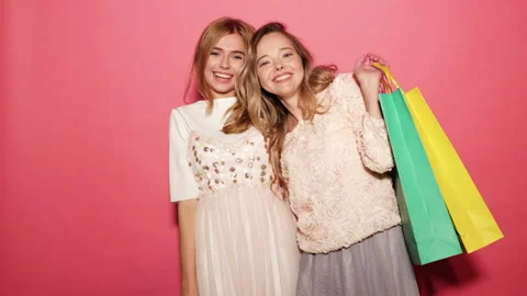 Portrait of two young stylish smiling blond women Stock Footage 140538715