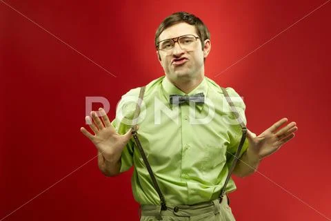 Portrait of typical nerd posing and grimacing at camera Stock Photos