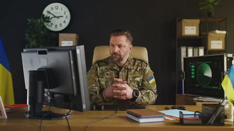 Portrait of Ukrainian army general working on computer in intelligence office Stock Footage 333307005
