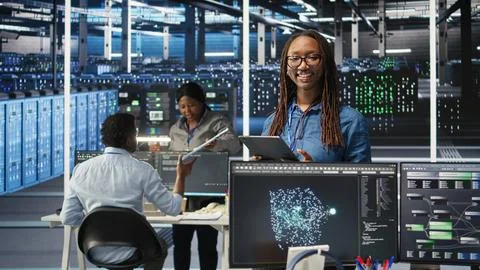 Portrait of upbeat server hub software developer using node tree software 写真素材