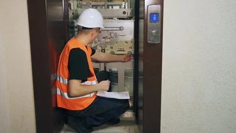 Portrait of a utility service engineer performing an inspection of modern Vídeos de archivo 266229372