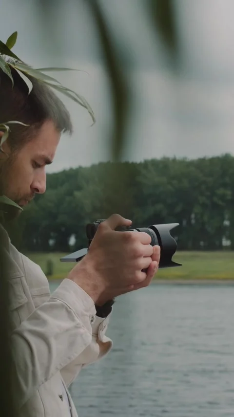 Portrait of videographer at the river Stock Footage 291716172