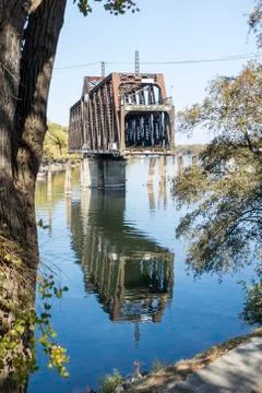 Portrait view drawbridge in mid move partially open to let a ship through Stock Photos