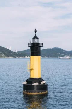 Portrait view of lighthouse, floating in the ocean in Busan, South Korea. Stock Photos