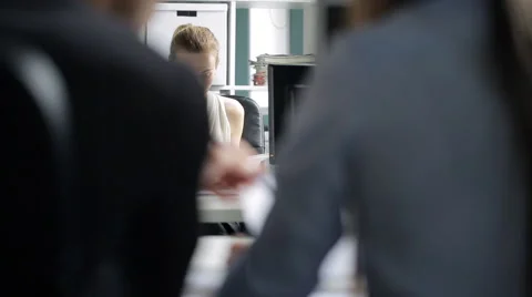 Portrait view through co-working people shoulders on boss 動画素材 66549265