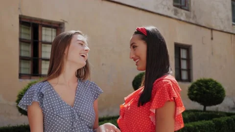 Portrait view of two best cheerful sisters in a stylish look having fun. Video stock 138078458