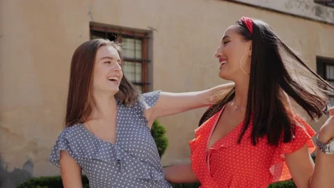 Portrait view of two best cheerful friends in a stylish look playfully dance. Stock Footage 138079160