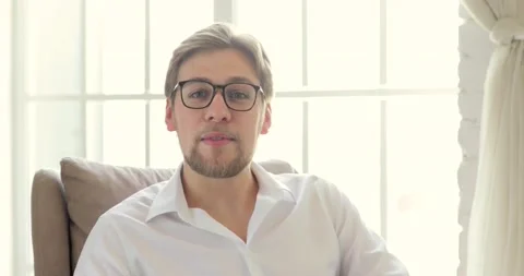 Portrait of vlogger blogger is talking, creating video content sitting on chair. Stock Footage 131858299