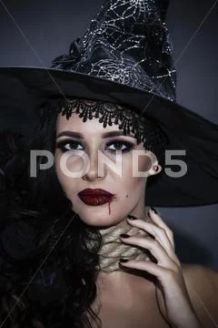 Portrait of a witch with a rope throat. halloween concept Stock Photos