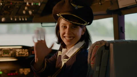 Portrait of woman airline copilot in command to fly airplane Stock Footage 202102417
