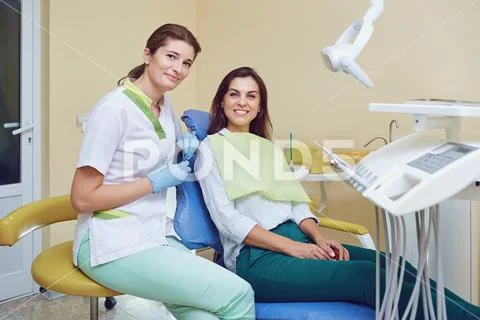Portrait of woman and dentist in dental clinic. Stock Photos