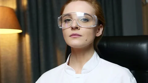 Portrait of woman computer IT engineer in goggles seriously looking at camera. Stock Footage 103388031