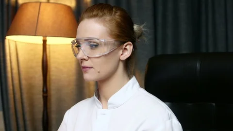 Portrait of woman computer IT engineer in goggles seriously looking at camera. Stockbeeldmateriaal 103718761