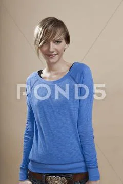 Portrait of a woman giving a sexy look, studio shot Stock Photos